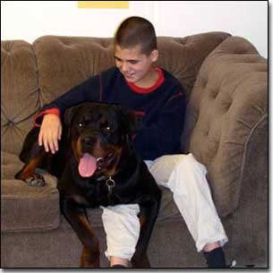 Rottie-Gabriel and KC smiling on couch