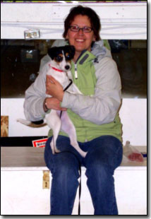 Manners class owner holding her dog and smiling